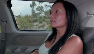 Raven haired busty Colombian mommy Casandra is proud of her perfect huge fake boobs. Thats why she takes off her stingy apex and brassiere in the back of a car in front of the camera with no shame!